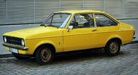 1280px-1977_Ford_Escort_1.3_two-door_(base),_front_left_side.jpg